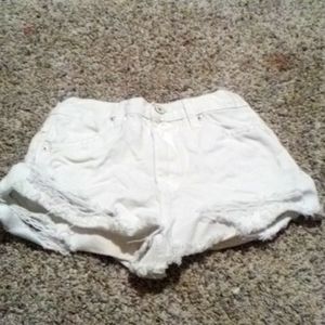 White ripped jean shorts